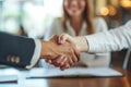 Close Up of Two People Shaking Hands, A businesswoman shaking hands with a bank manager after securing a loan, AI Generated Royalty Free Stock Photo