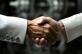 A close up of two people shaking hands. Gears on the lapel Royalty Free Stock Photo