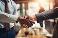 A Close Up Of Two People Shaking Hands