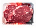 Close Up of Two Raw Red Beef Steaks in a White Styrofoam Tray on White Background Royalty Free Stock Photo
