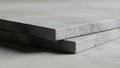 Close up of two rectangular blocks of foam with a rough texture on a white surface Royalty Free Stock Photo