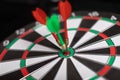 Three Darts hit red target close-up Royalty Free Stock Photo