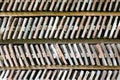 Close up on two rows of arranged bricks on a wood shelf. Royalty Free Stock Photo