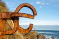 Close-up of two sculptures of the comb of the Wind, at sunrise with blue sky, horizontally, in San Sebastian, Basque Country