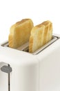 A close up of two slices of golden brown toast in an electrical toaster