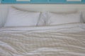 Close up two white crumpled pillow on bed in the bedroom. Royalty Free Stock Photo