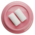 Close-up of two white rectangular pieces of chewing gum on a pink circular dish white background Royalty Free Stock Photo