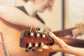 Close-up of two Young girls playing guitar on the couch at home. Friendship. Stay at home. Toned. Selective focus on Royalty Free Stock Photo