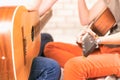 Close-up of two Young girls playing guitar on the couch at home. Friendship. Stay at home. Toned. Selective focus on Royalty Free Stock Photo