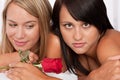 Close-up of two young naked woman with red rose Royalty Free Stock Photo