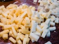 Close-up of the typical cheeses used in the recipe for making Pizzoccheri. Typical dish from Valtellina, Lombardy, Italy