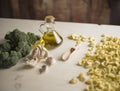 Close-up of typical Italian Apulian fresh pasta orecchiette on a table with broccoli, garlic, oil and chilli powder Royalty Free Stock Photo