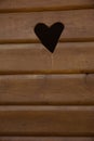 Close-up of typical old wooden outhouse with heart Royalty Free Stock Photo