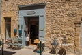 Close-up of typical stone houses and shops on a street of Lourmarin.