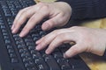 Close up of typing female hands on keyboard. Royalty Free Stock Photo