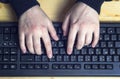 Close up of typing female hands on keyboard. Royalty Free Stock Photo