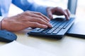 Close up of typing male hand on keyboard concept - Businessman working on keyboard and mouse computer man sitting on the table and Royalty Free Stock Photo