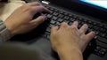 Close-up of typing male hands. close up blurred view of male hand touching computer keyboard. Close-up of male hands Royalty Free Stock Photo