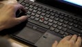 Close-up of typing male hands. close up blurred view of male hand touching computer keyboard. Close-up of male hands Royalty Free Stock Photo