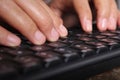 Close-up of typing male hands