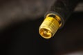 Close-up tyre valve on car wheel nipple Royalty Free Stock Photo