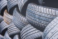Close up tyres stacked outside for recycling