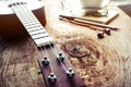 Close up of ukulele on old wood background with soft light
