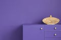 Close-up of an ultra violet wall and a matching cabinet with a g Royalty Free Stock Photo