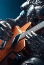 Close up of an ultrarealistic robot playing the electric guitar with the concept of artificial intelligence, electronic music, Royalty Free Stock Photo