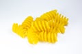 Close up uncooked spiral pasta fusilli on white background Royalty Free Stock Photo
