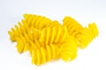 Close up uncooked spiral pasta fusilli on white background Royalty Free Stock Photo