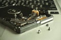 Close up of uncovered broken 2.5 inch hard drive with unreadable data. Royalty Free Stock Photo