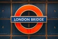 Close up of underground station roundel sign on the platform of London Bridge station, UK