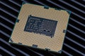 Close-up of the underside of a modern processor with many gold-p