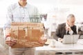 Close up of unemployed woman holding the box with her belongings Royalty Free Stock Photo