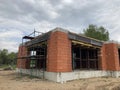 Close up of unfinished house in residential area. Modern architecture of construction brick house for comfortable stay