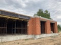 Close up of unfinished house in residential area. Modern architecture of construction brick house for comfortable stay