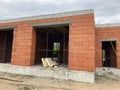 Close up of unfinished house in residential area. Modern architecture of construction brick house for comfortable stay