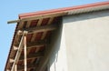 Close up on unfinished house roof soffit boards installation