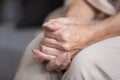 Close up unhappy lonely mature woman folded hands together