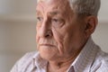 Close up unhappy lonely thoughtful older man looking in distance Royalty Free Stock Photo