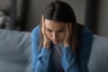 Close up unhappy woman suffering from strong headache and dizziness