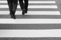 close-up on unidentified people legs crossing street Royalty Free Stock Photo