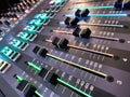 Close up unique perspective of sound system faders Royalty Free Stock Photo
