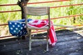 Close up United States of America flag put on the old Plastic Chair. Royalty Free Stock Photo
