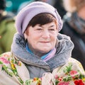 Close up of unknown beautiful aged woman in national folk clothes