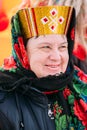 Close up of unknown beautiful aged woman in national folk clothe