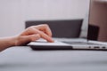 Close up of unknown young caucasian woman using laptop, female hands typing, writing notes, studying languages, distance learning Royalty Free Stock Photo