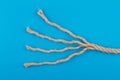 Close up of unraveled rope on blue background Royalty Free Stock Photo