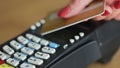 Close-up of unrecognizable caucasian woman using credit card contactless payment. Modern technologies and restaurant Royalty Free Stock Photo